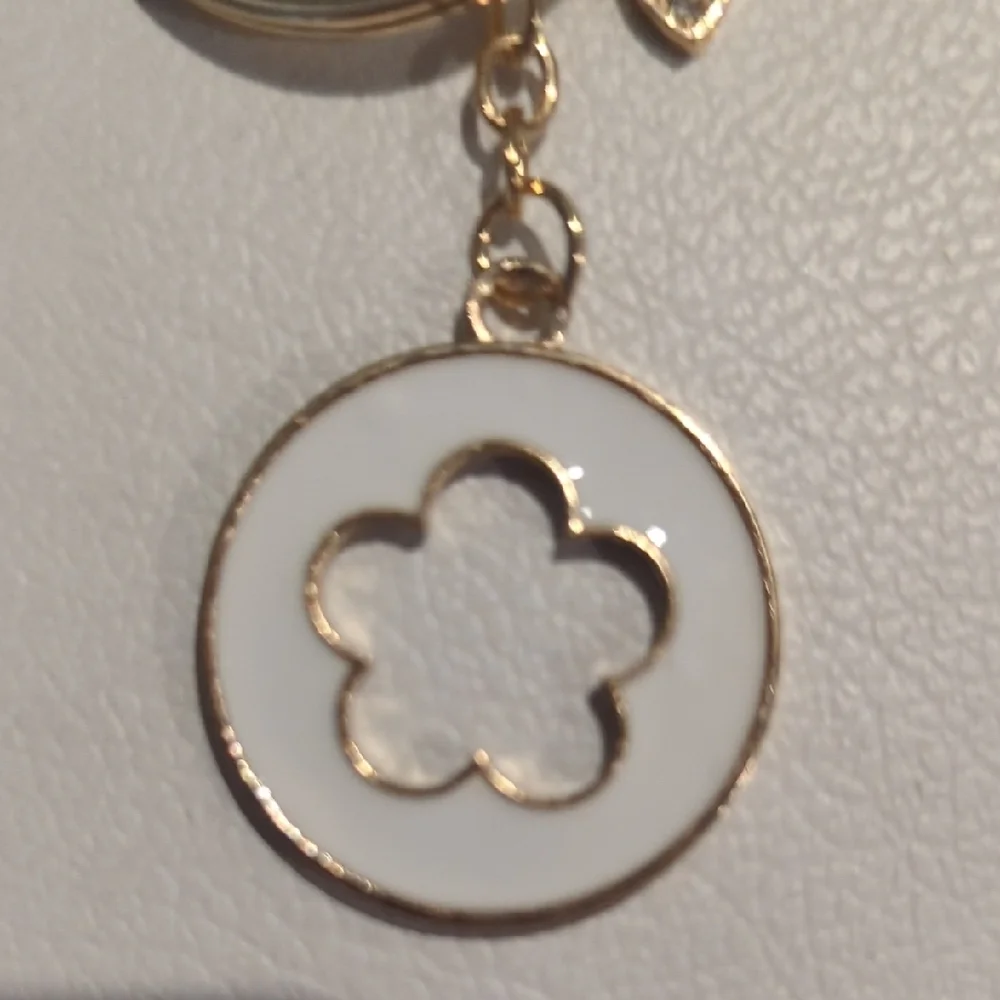 Elegant Gold Keychain with Floral Charm